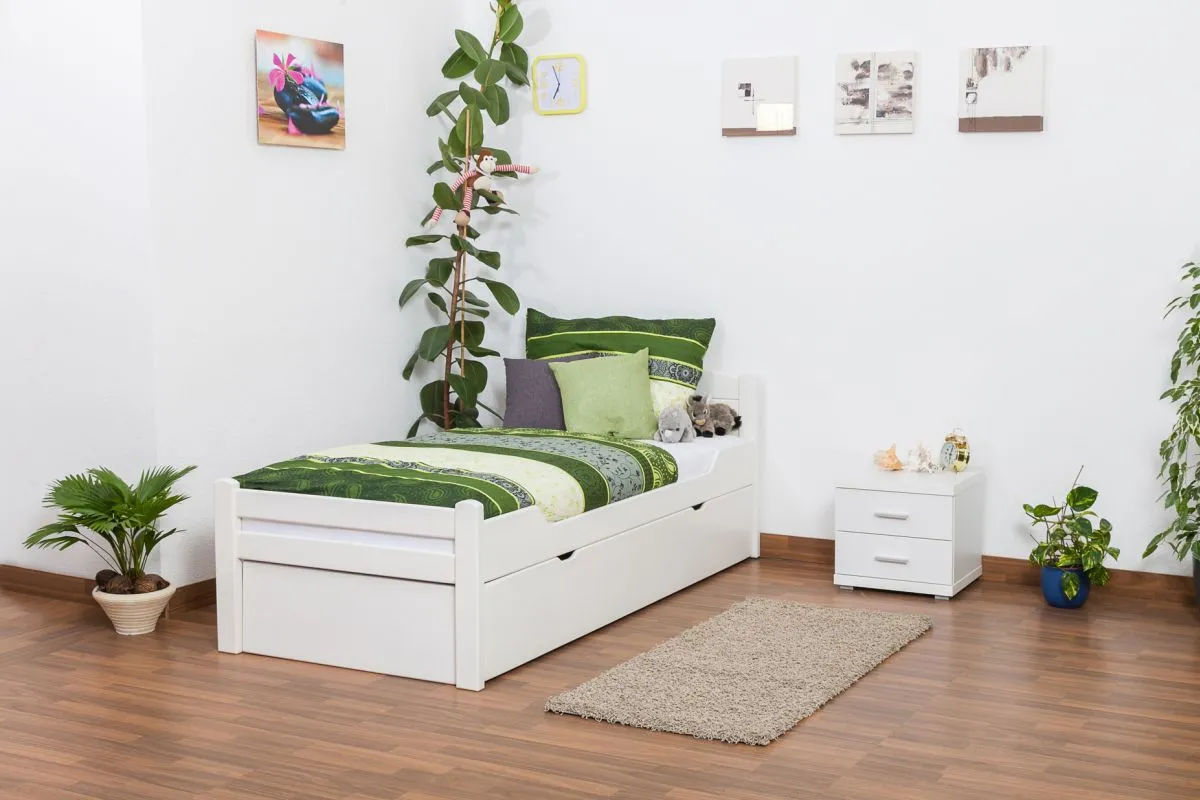 Einzelbett / Stauraumbett "Easy Premium Line" K1/h Voll inkl. 2. Liegeplatz und 2 Abdeckblenden, 90 x 200 cm Buche Vollholz weiß lackiert