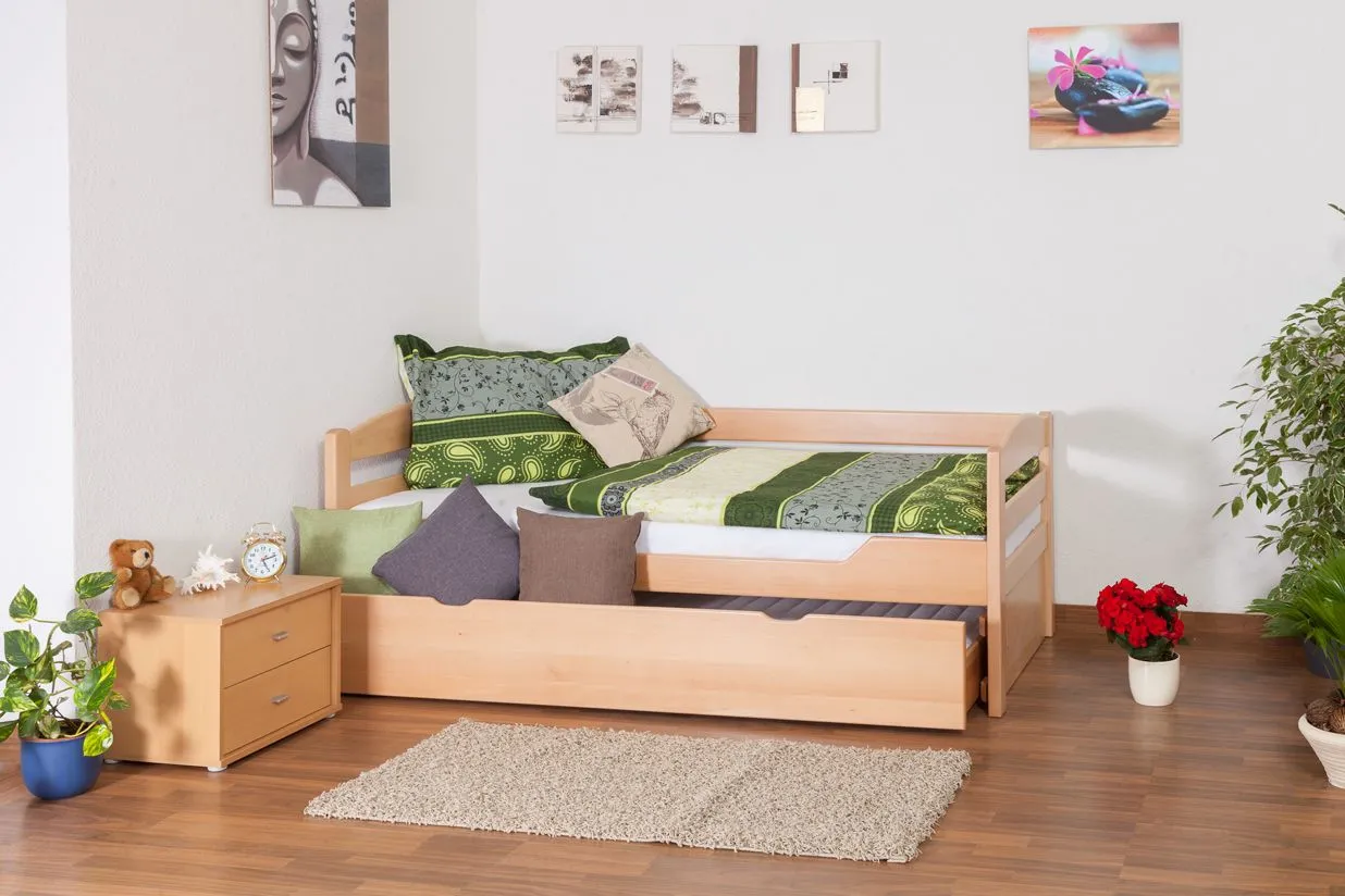 Einzelbett / Stauraumbett "Easy Premium Line" K1/h/s inkl. 2. Liegeplatz und 2 Abdeckblenden, 90 x 200 cm Buche Vollholz massiv Natur